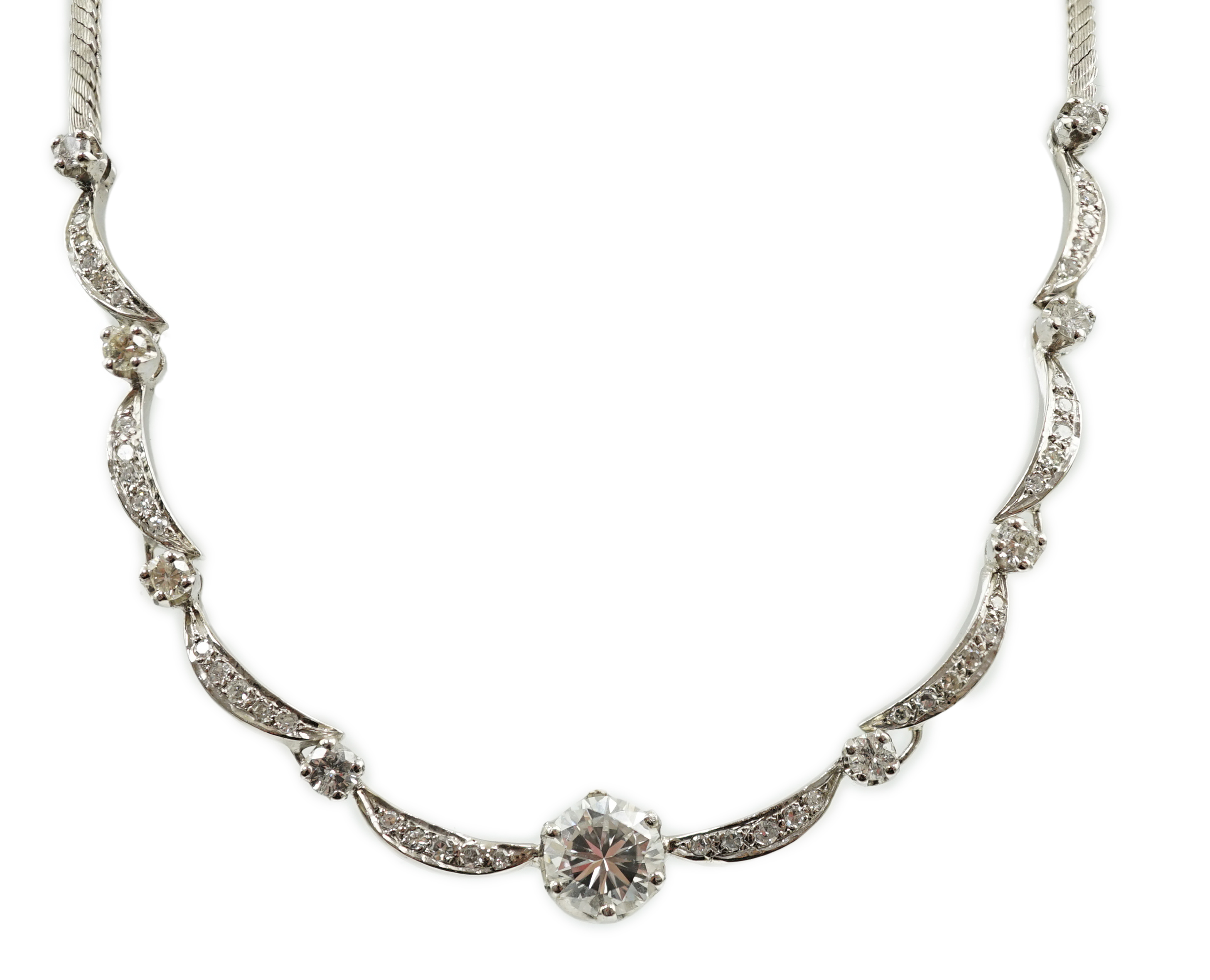 A modern 18ct white gold and diamond cluster set necklace